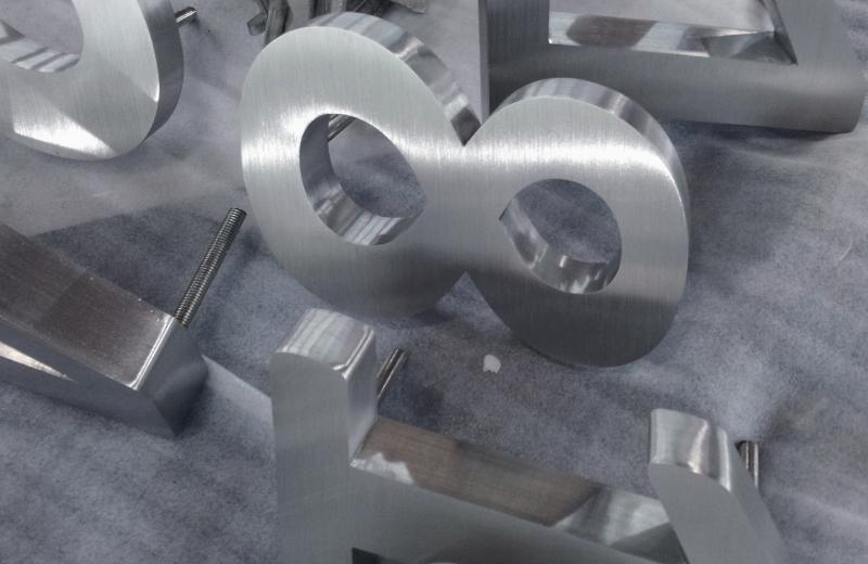 Fabricated brushed stainless steel numbers