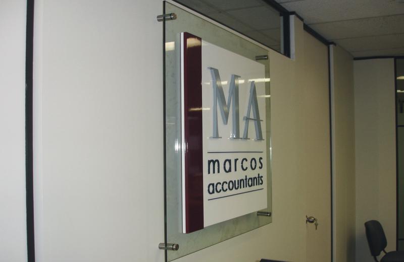 glass signage with raised logo