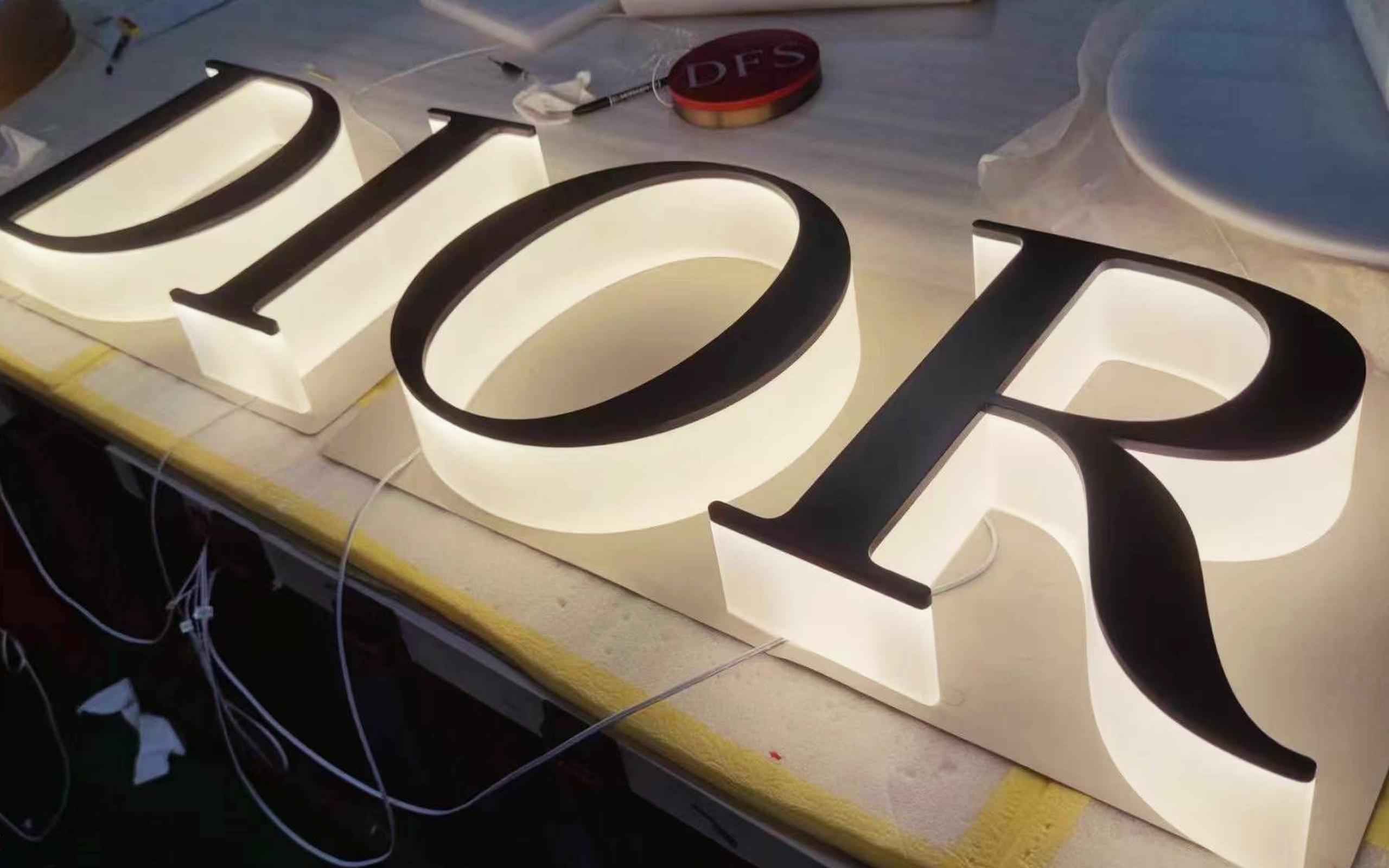 Dior letters with an extreme thick acrylic backing illuminated sign