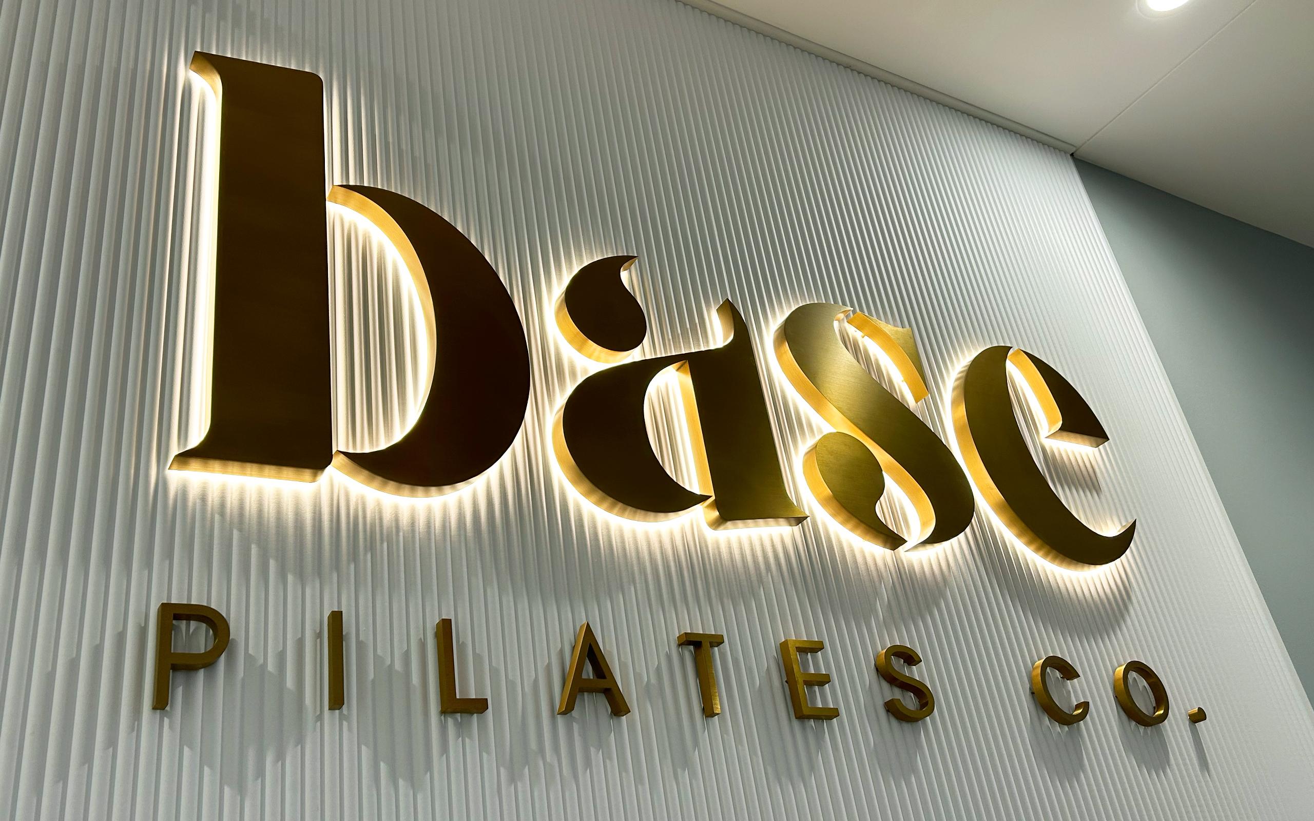 base-illuminated-brass-metal-signage